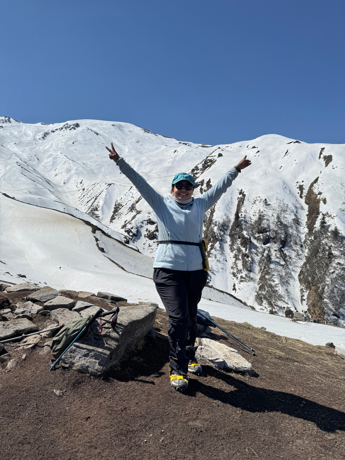 Alisha trekking on snow-covered Himalayan peaks